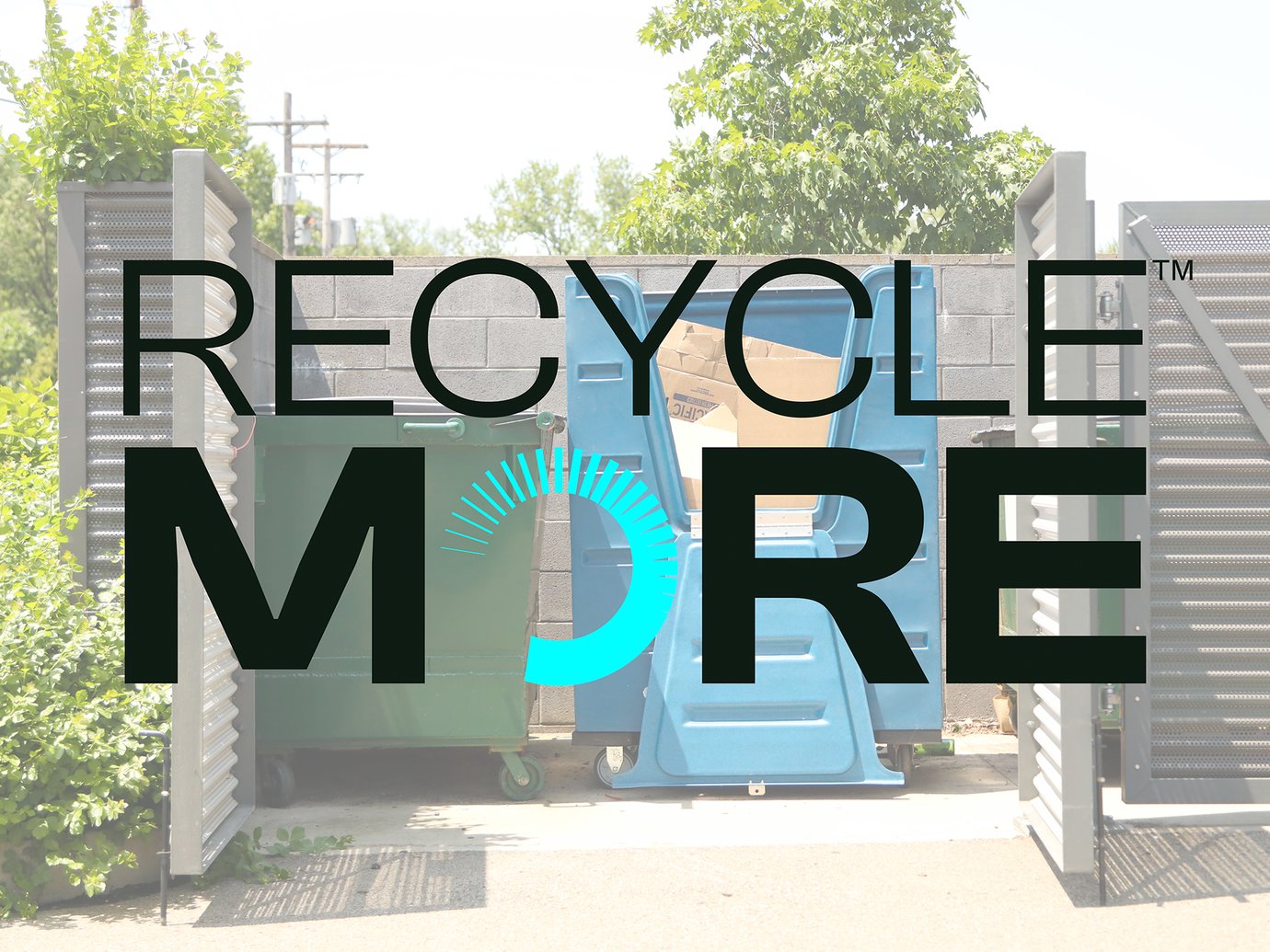 dumpsters in a corral with a