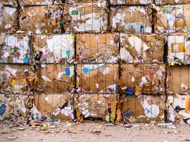 stacked bales of cardboard